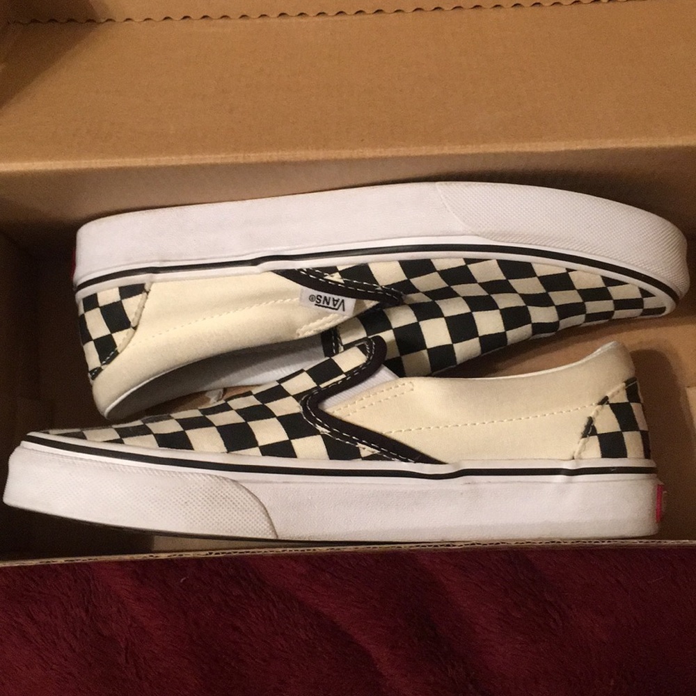Checkered board slip on vans